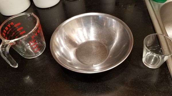 Measuring cup, metal bowl, small glass