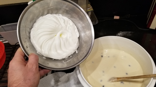 Batter in mixing bowl. Beaten egg whites in metal bowl.