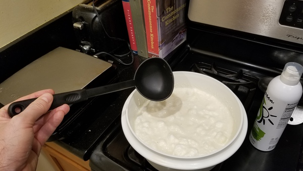 Batter in bowl, ladel, waffle iron