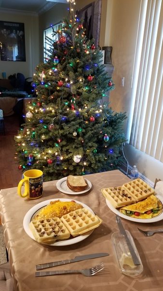 Plates with waffles and omelettes. Christmas tree.